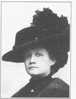 A black and white photograph of a woman, Ola Delight Smith, shot from the chest up, wearing a hat