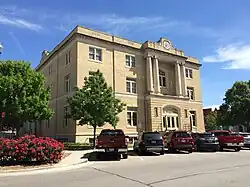 Image of Old court house with cars parked outside