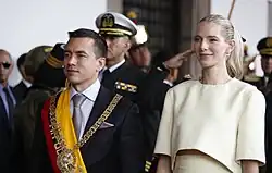 Noboa is standing next to his wife Lavinia Valbonesi during his inauguration.