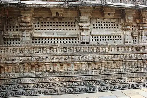 Wall relief, pierced windows and molding frieze