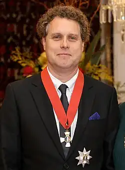 Beck holding a medal box