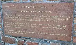 Plaque at Gorey: "Captain Ed Clark, Lieutenant George Haas: On 8 January 1945 these two American officers escaped from their prisoner of war camp in St. Helier. Assisted by local residents and in particular Deputy W.J. Bertram BEM, of East Lynne, Fauvic, they successfully avoided recapture by the German forces. On the night of 19 January 1945 they removed a small boat from this harbour and 15 hours later after an arduous crossing in bad weather, landed near Carteret on the French Cotentin Peninsula. This tablet was unveiled on the 50th anniversary of this event on 20 January 1995 by Sir Peter Crill KBE, Bailiff of Jersey."