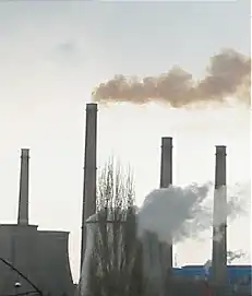 An image of industrial chimney smoke causing air pollution.