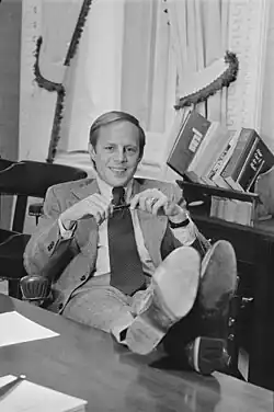 Casual portrait of John Dean sitting in his office with his feet on the desk