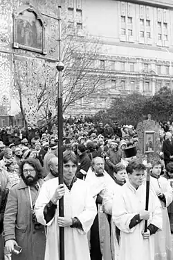 Russian Orthodox clergy at the front of a large crowd