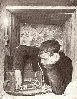 Soldier listening to a crystal radio during World War I, 1914