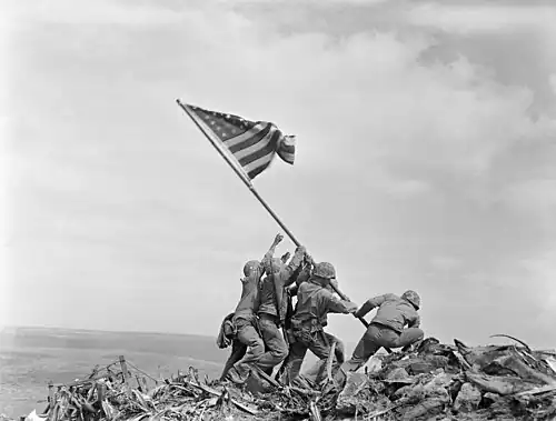 Private First Class Ira Hayes as one of the flag raisers on Mt. Suribachi.