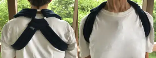 A cloth brace to hold the scapulas in retraction to reduce shoulder symptoms, such as collarbone pain