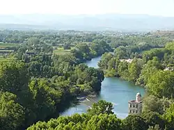 View from Béziers to the river Orb showing a weir and the Ancien Moulin de Bagnols