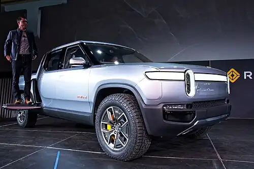 RJ Scaringe, Rivian CEO, demonstrates the Gear Tunnel door strength