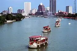 Packet boats on the Genesee River, with the Rochester skyline in the background, USA, c.2005