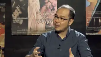 A man talking in an interview