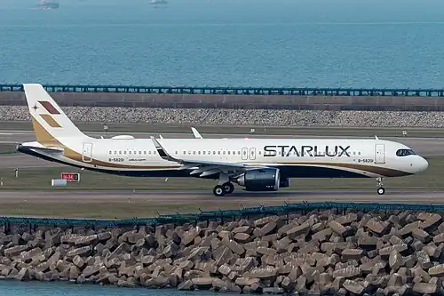 This Starlux Airlines A321neo has doors R3/L3 plugged and replaced with windows (seating: 188, maximum: 200).[15] (The interior panel is windowless.[21])