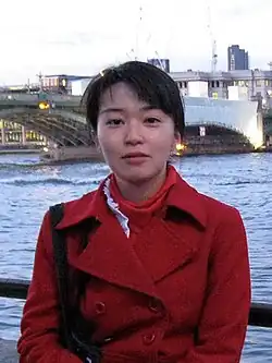 Sae Kitamura at a bridge