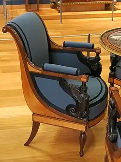 Armchair of the salon of Juliette Récamier; attributed to Jacob Frères; c.1798; various types of wood; 84.5 x 62.2 x 62 cm; Louvre[76]