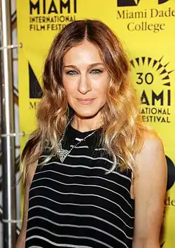 Sarah Jessica Parker in black outfit and wearing a flashy diamond necklace