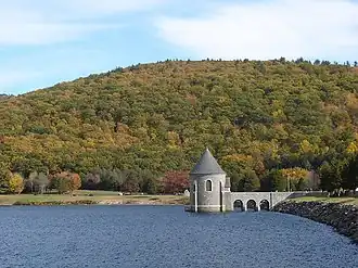 The Saville Dam impounds the East Branch Farmington River to form Barkhamsted Reservoir.