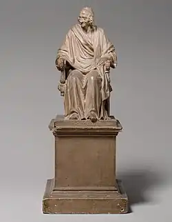 Seated Voltaire; by Jean-Antoine Houdon; 1778; plaster, tinted to imitate terracotta; overall: 35.6&nbsp;cm ×&nbsp;14.6&nbsp;cm ×&nbsp;20&nbsp;cm (14.0&nbsp;in ×&nbsp;5.7&nbsp;in ×&nbsp;7.9&nbsp;in); Metropolitan Museum of Art