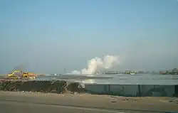 Gas plumes next to excavators working