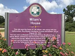 Sign identifying the site of Milam's house, near Glendora Gin