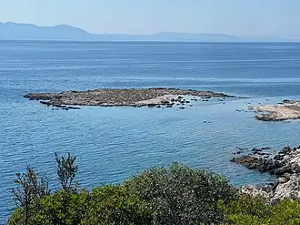 Smaller Garip Island viewed from the larger island with Lesbos in the distance