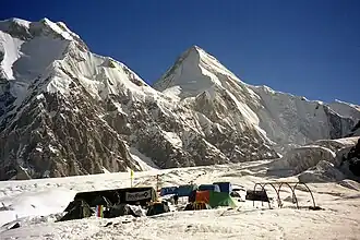 South Inylchek Base Camp, at 4,000 m on the glacier's southern moraine, looking northwest to Chapaev Peak and Khan Tengri in the distance