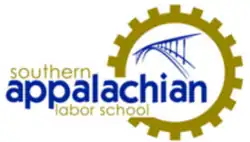 A gold gear with a blue bridge inside and reading "southern appalachian labor school"