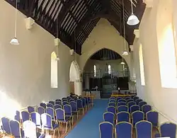 Rood screen at the Church of St Peter, Draycott, Somerset, 1894, which Historic England suggests may be by Prynne.[19]