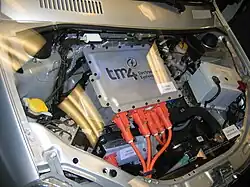 A demonstration car with an electric engine is shown as an exhibit.