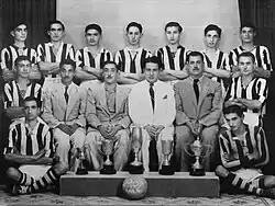 Allawi with the Thanawiyat Al-Basra team in 1945, with the standing players, third from the left.