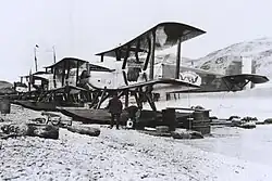 Photograph of three Douglas World Cruiser aircraft on a beach, Alaska, 1924. New Orleans is in the foreground.
