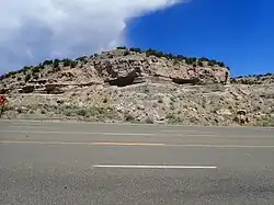 Road cut in Puye Formation, showing gravel beds of the Totavi Lentil near its type section.