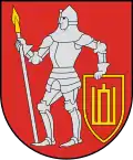 A coat of arms depicting a man in full body armour holding a white spear in his right hand and a red-and-yellow shield in his left hand