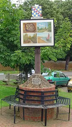 Bench and signpost in Snettisham