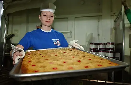 Sheet cake with pineapples and maraschino cherries