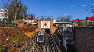 A VAL 208 train departing Triolo station in Villeneuve-d'Ascq