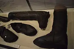 Leather shoes and boots on display.