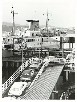 Image of ship and cars at dockside