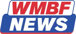 A white slanted rounded parallelogram overlapping a slanted blue rounded parallelogram. The white parallelogram has the word "WMBF" in red in a bold sans serif. The blue parallelogram has the word "NEWS" in white in the same sans serif. There is a slight red underline on the blue parallelogram.