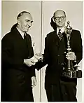 Eddie Rickenbacker (left) presents the Fawcett Aviation Award to Fred E. Weick (right), January 1946