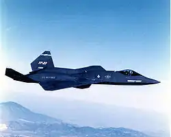 The YF-23 painted charcoal gray, the "Gray Ghost", pictured flying