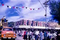 Crowds watching the Bangtail Muster on Todd Street, 1960