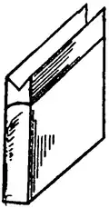 A thin cuboid standing on a narrow edge with a V-shaped grove in the top side.