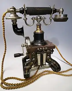 Colour photograph of a late nineteenth-century telephone.