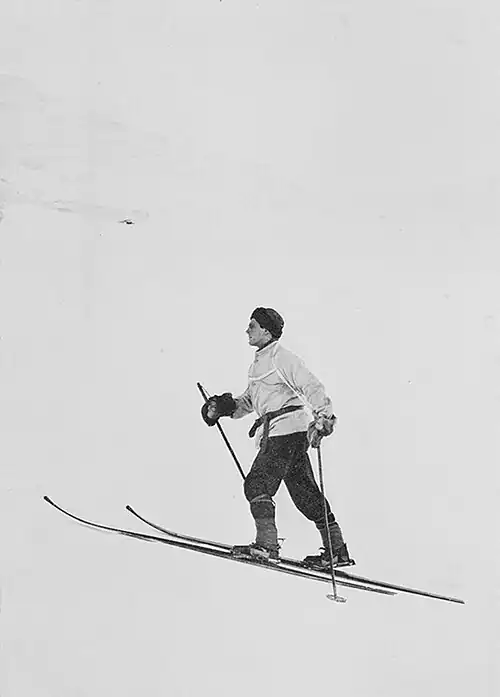 Photo of a man on skis heading uphill