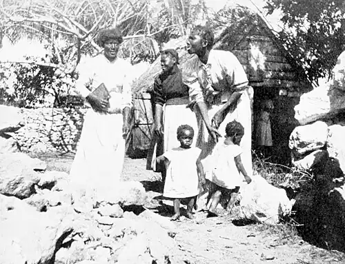Family represented in a village scene