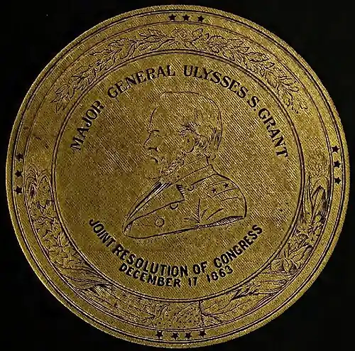 A gold seal with a profile drawing of Grant′s face and the words “MAJOR GENERAL ULYSSES S. GRANT” inscribed in a semi-circle above and “JOINT RESOLUTION OF CONGRESS / DECEMBER 17 1863” below