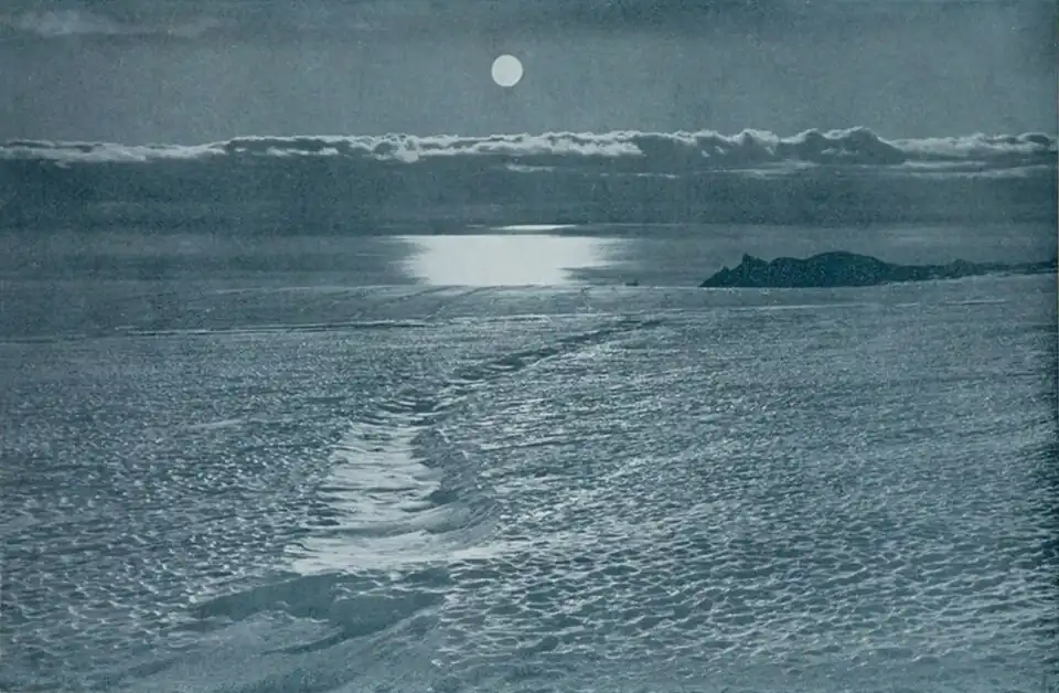 Photo of a flat expanse of ice bisected by a shallow ditch with a smoother texture