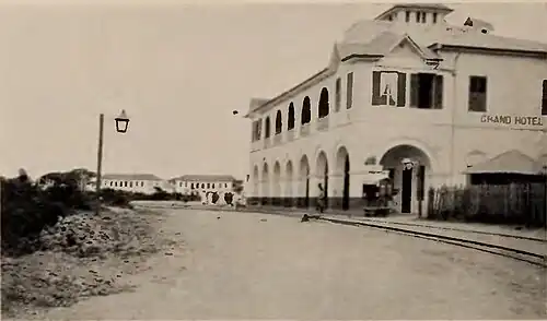 A road with a large hotel on the side