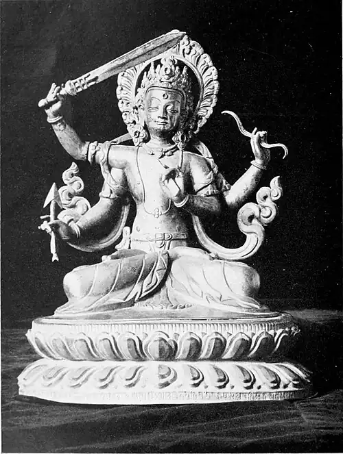 Black and white photograph of a statuette of Manjusri.
